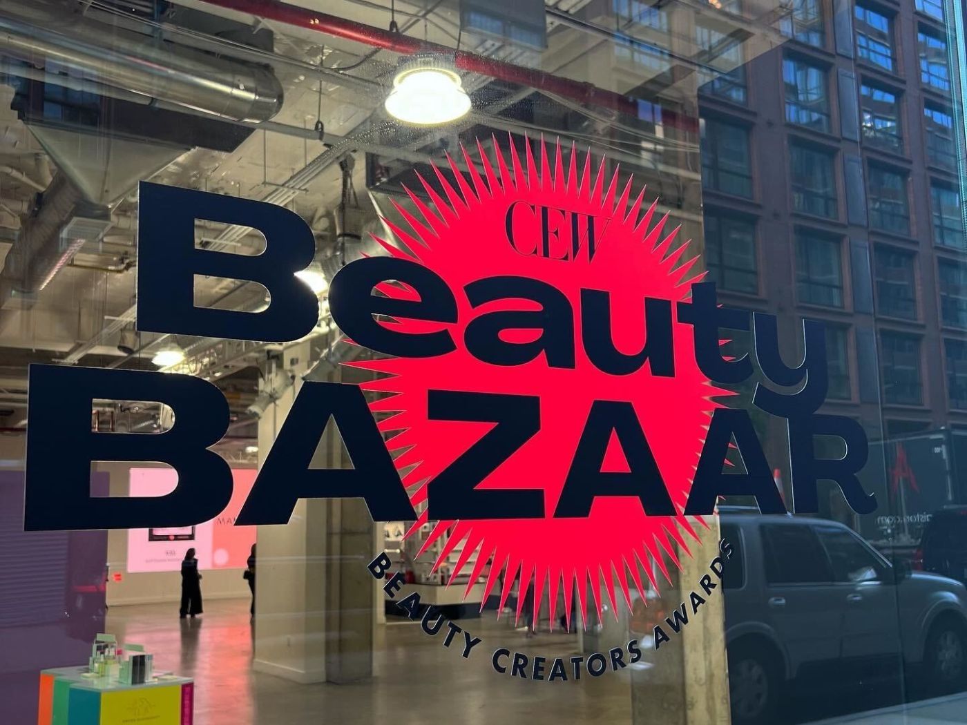 Beauty Bazaar logo and emblem on glass