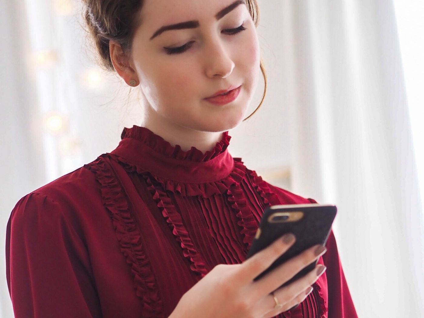 Young woman looking at her phone