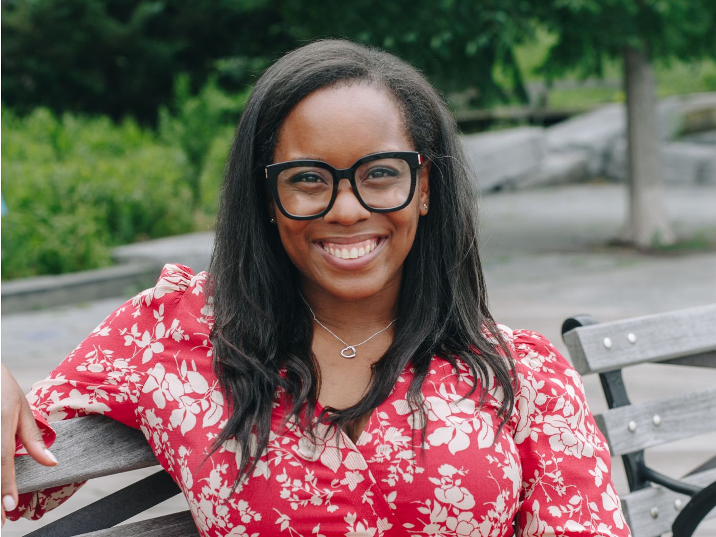 Headshot of Allyssa Munro sitting on a bench